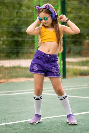 Female child dancing on sports pitch