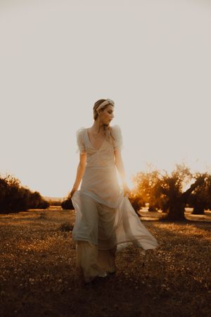 Woman in dress posing on nature