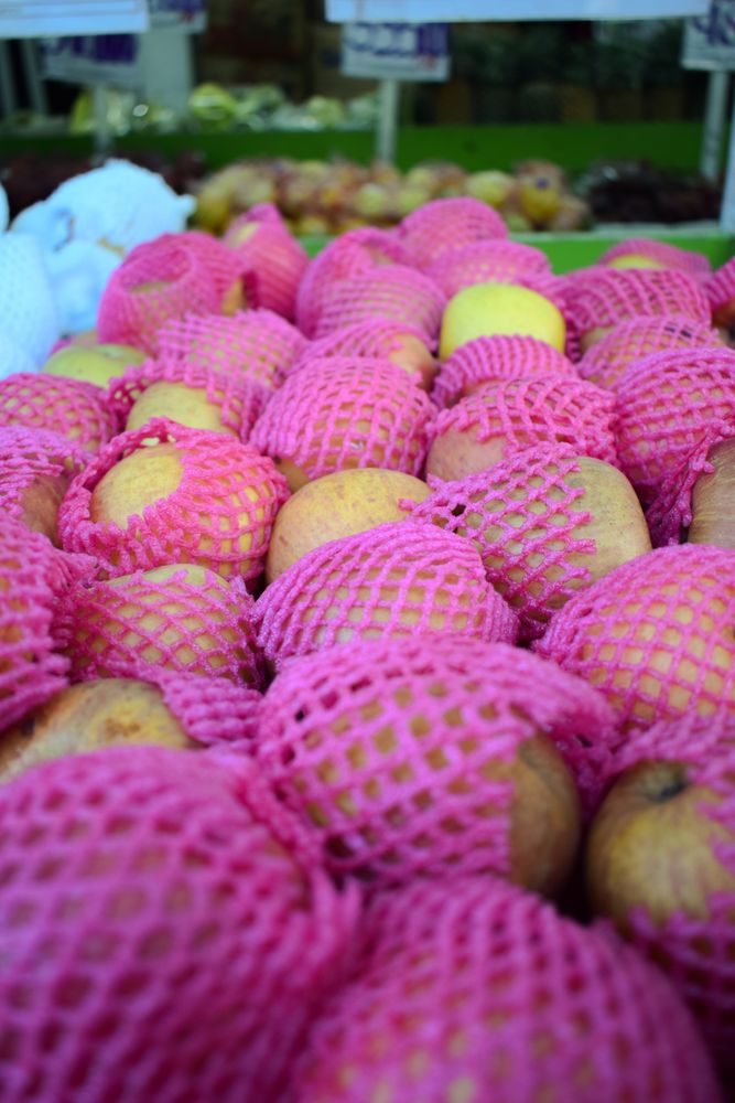 Pear fruits wrapped and for sale in store