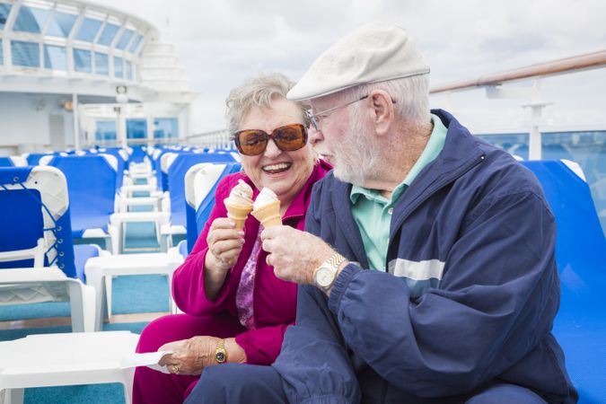 Mature Couple Enjoying Ice Cream On Deck Of Cruise Ship