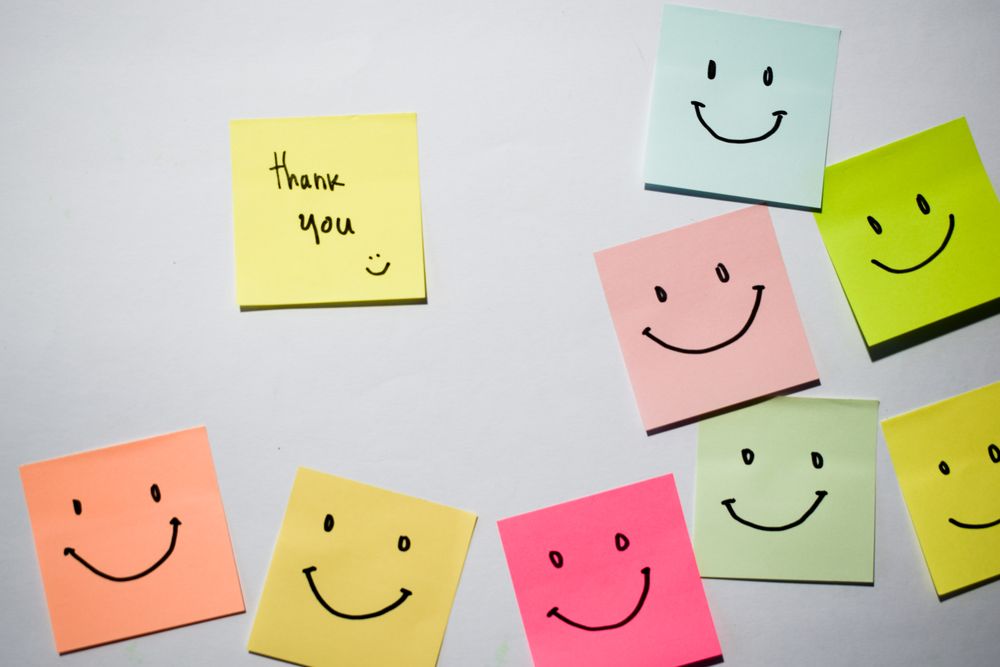 Thank you and smile emoticon on sticky notes