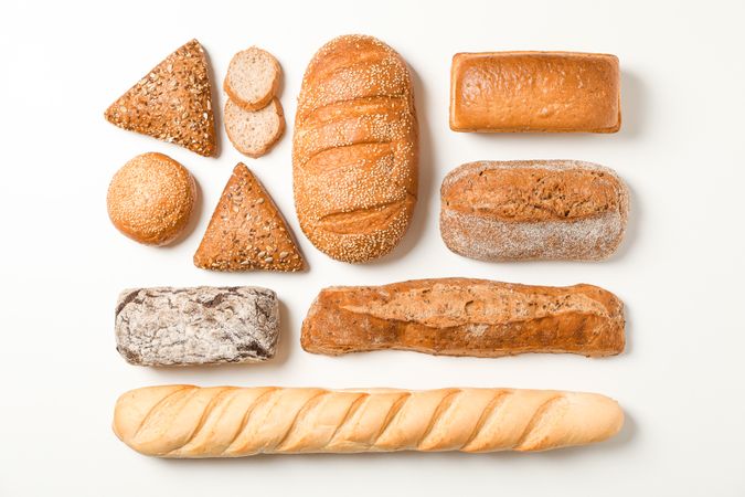 Flat lay composition with bakery products on blank background, space for text