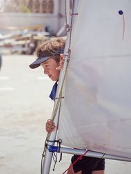 Young boy with sail of boat