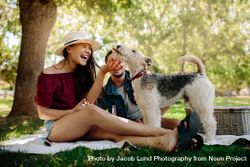 Couple on picnic with their dog 43OOg4