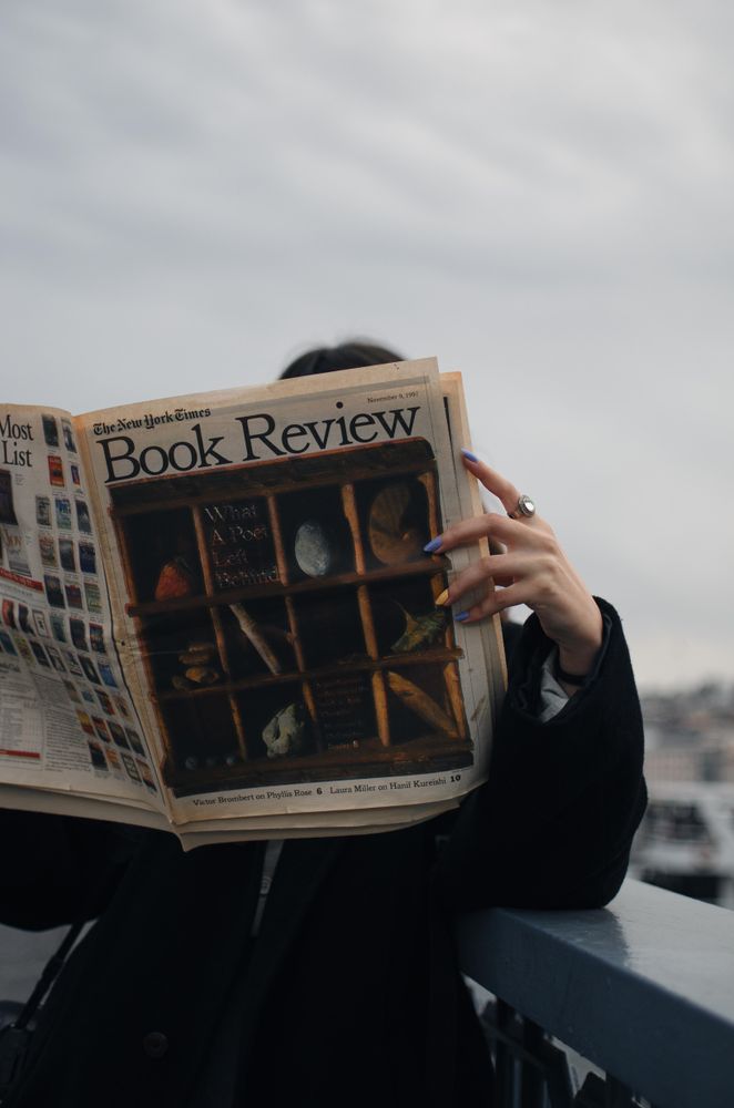 Person reading news paper