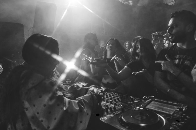 London, England, United Kingdom - Nov 9, 2022: B&W view of crowd from DJ decks