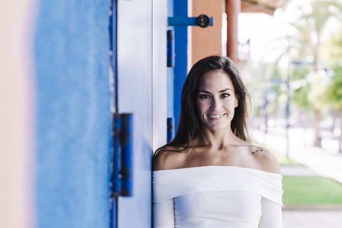 Portrait confident smiling young woman on urban street