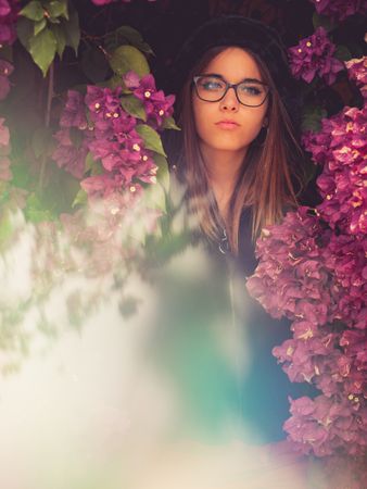 Woman on background of stunning violet flowers