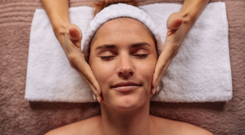 Female getting facial message treatment beauty salon