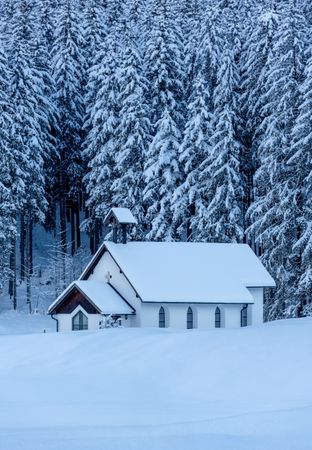 Winter scenery with a church minimalist in a deep snow nature, in the Bavarian Alps, Germany