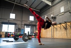 Woman practicing kick boxing in gym