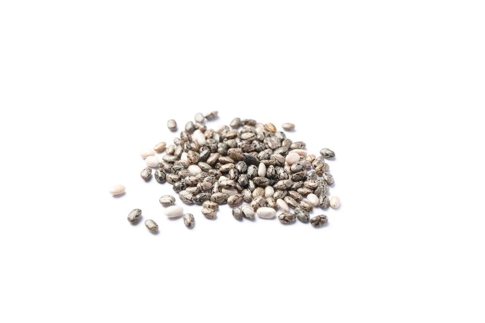Heap of chia seeds isolated on plain background, closeup