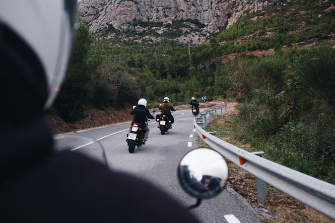 POV of bike rider following friends on motorcycles