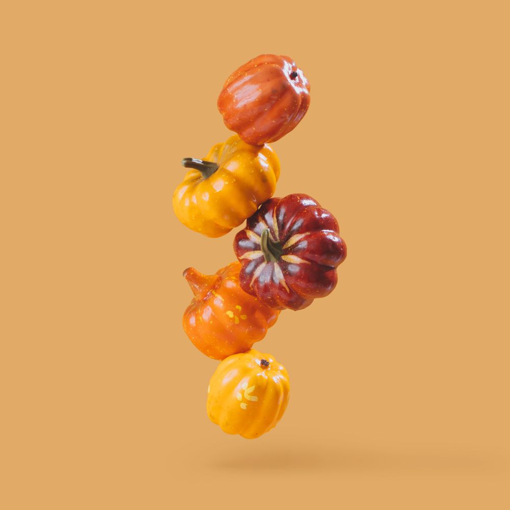 Autumn pumpkins with orange background