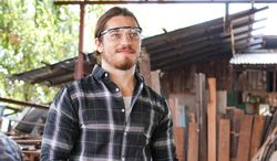 Man in safety glasses standing outside
