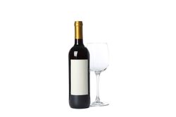 Empty glass and bottle with red wine isolated on plain background