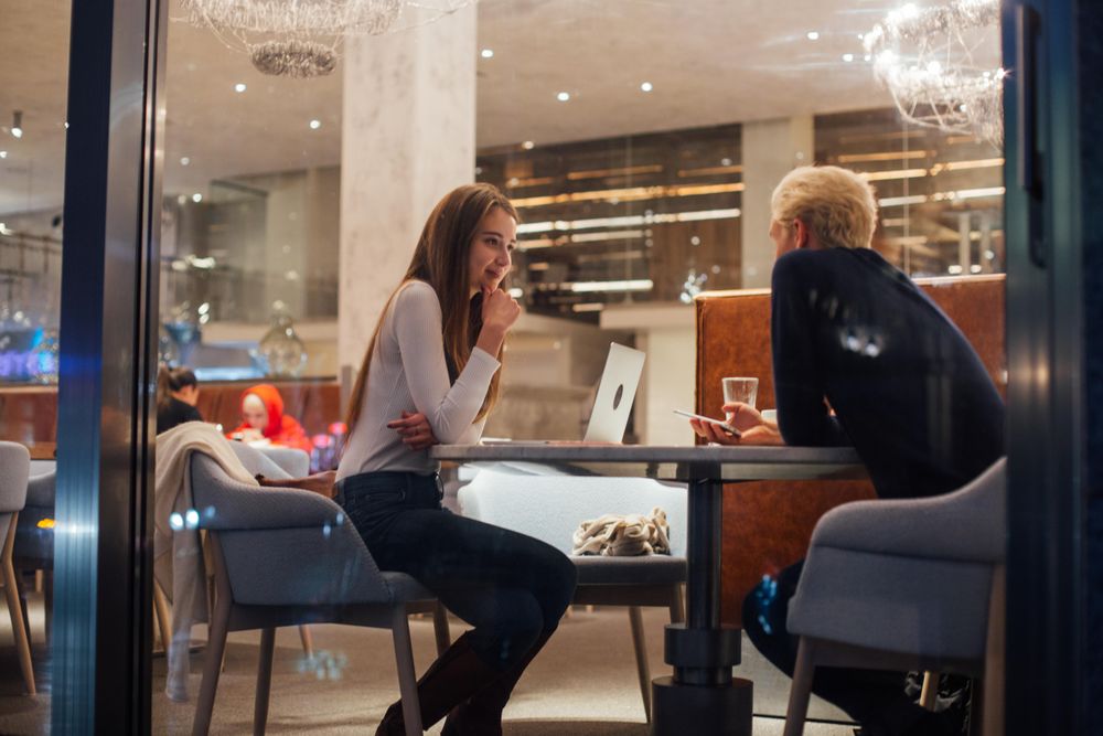 Man and woman having a brain storming session in a restaurant