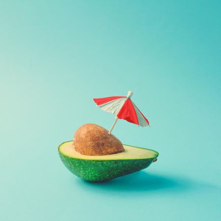 Avocado half with parasol