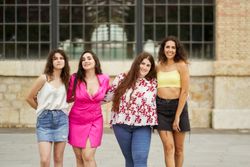 four friends having fun and talking gossip