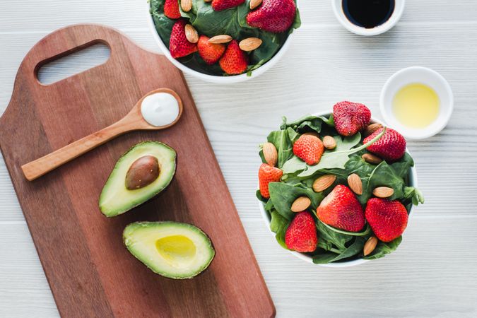 Strawberry served with almond and greenery