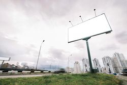 Billboard city entrance cloudy day