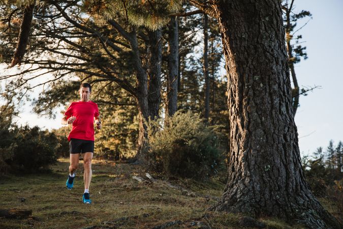 Sportsman running on countryside