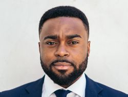 Close-up of a confident Black businessman looking at camera