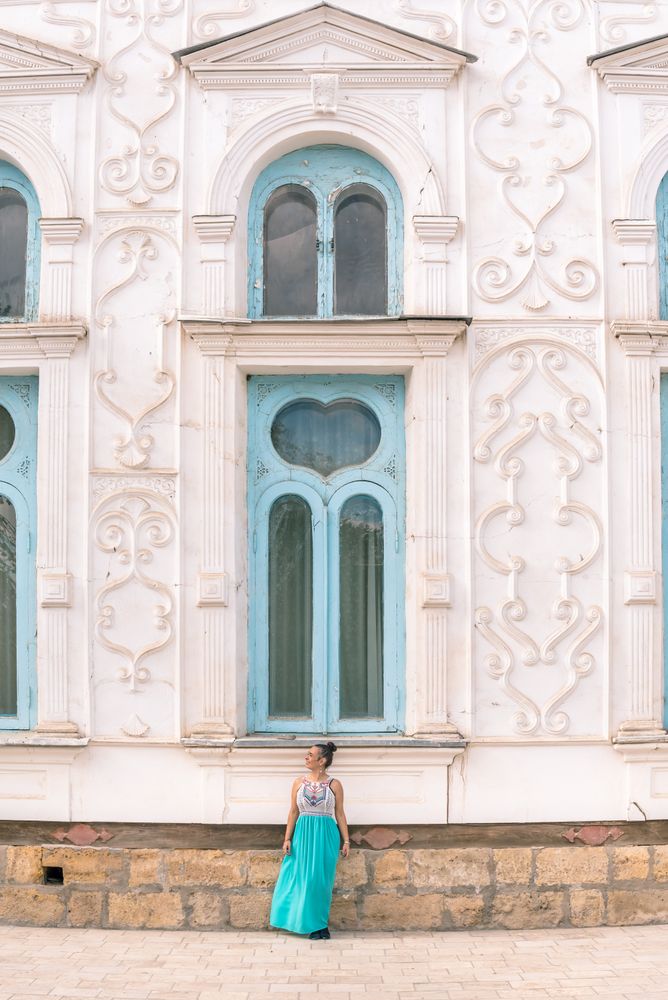 Woman leaving ornamental building