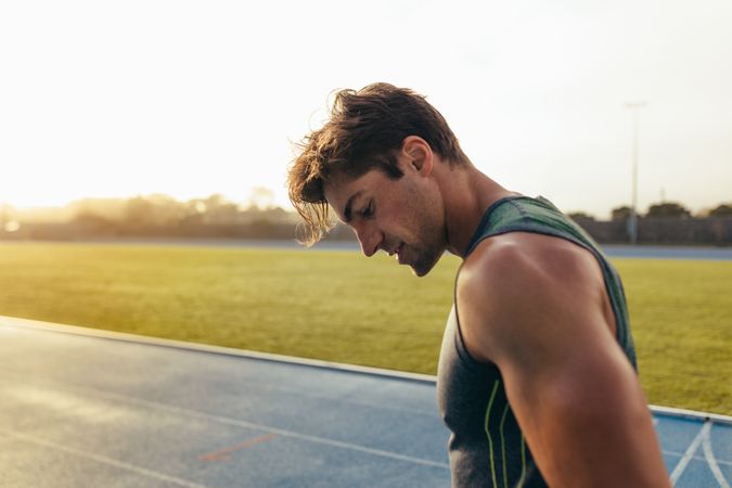 Athlete resting between sets on running track