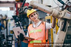 Female industrial engineer or technician worker in hard helmet 0yrj15
