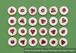 Linzer Christmas cookies top view on a green background 5rjR35