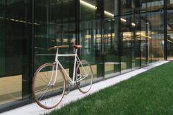 Bicycle parked outside modern building