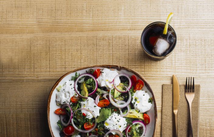 Vegetables salad with onion greens and cream sauce