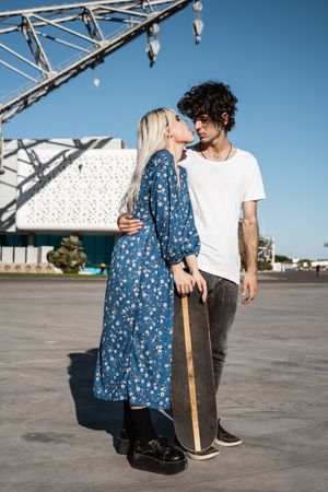 Couple standing near modern building