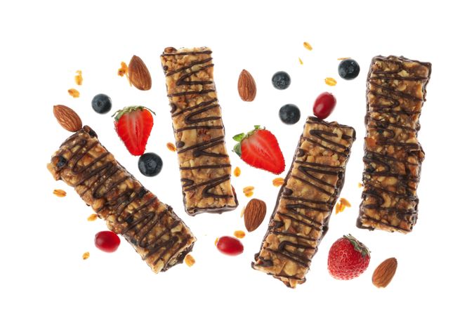 Tasty granola bars isolated on blank background