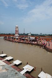 Crowds of people bathe in Ganges river in Rishikesh, India