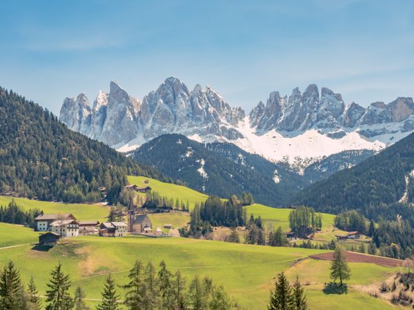Small beautiful village between mountains with snow