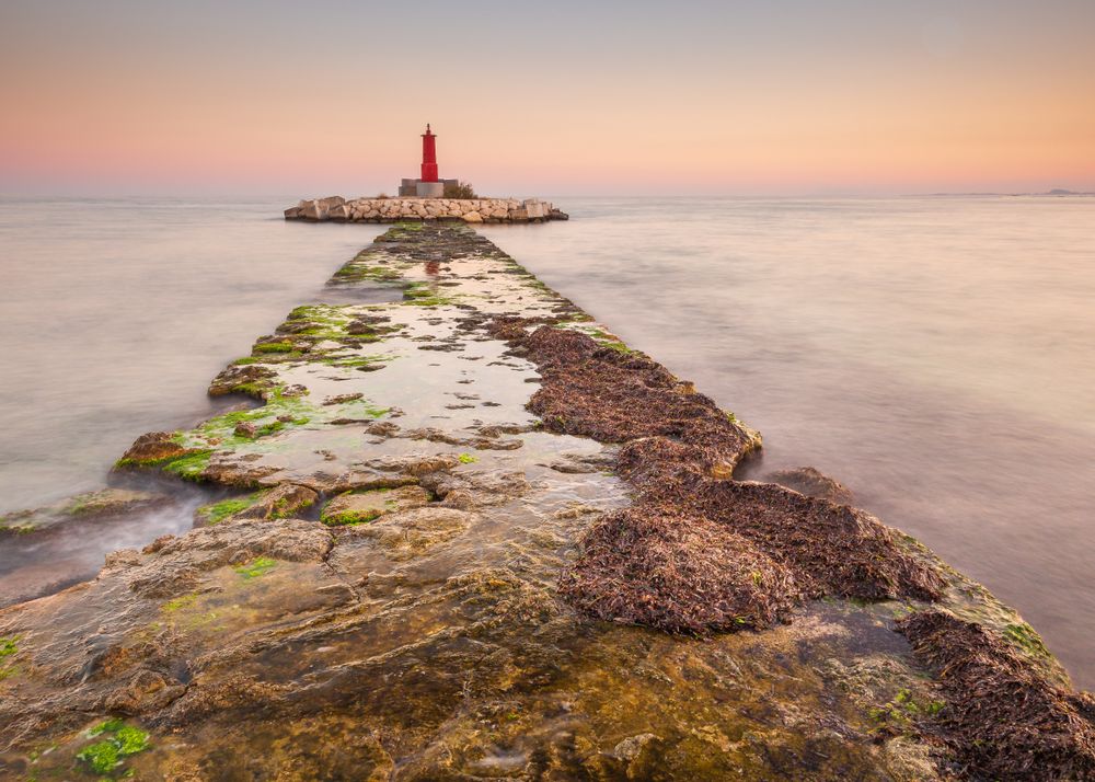 Rough path to islet with lighthouse