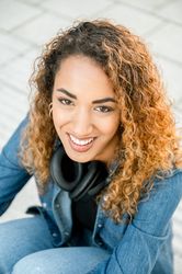 Smiling woman with curly hair