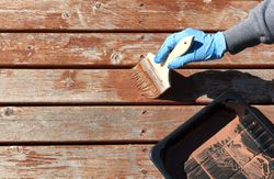 Staining home outdoor deck for weathered cedar planks