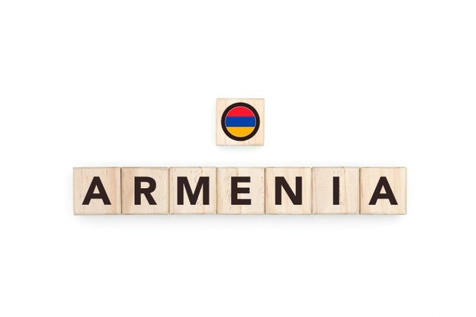 Wooden blocks bearing the name and flag of Armenia.