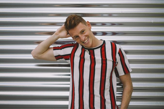 Man leaning on steel garage door