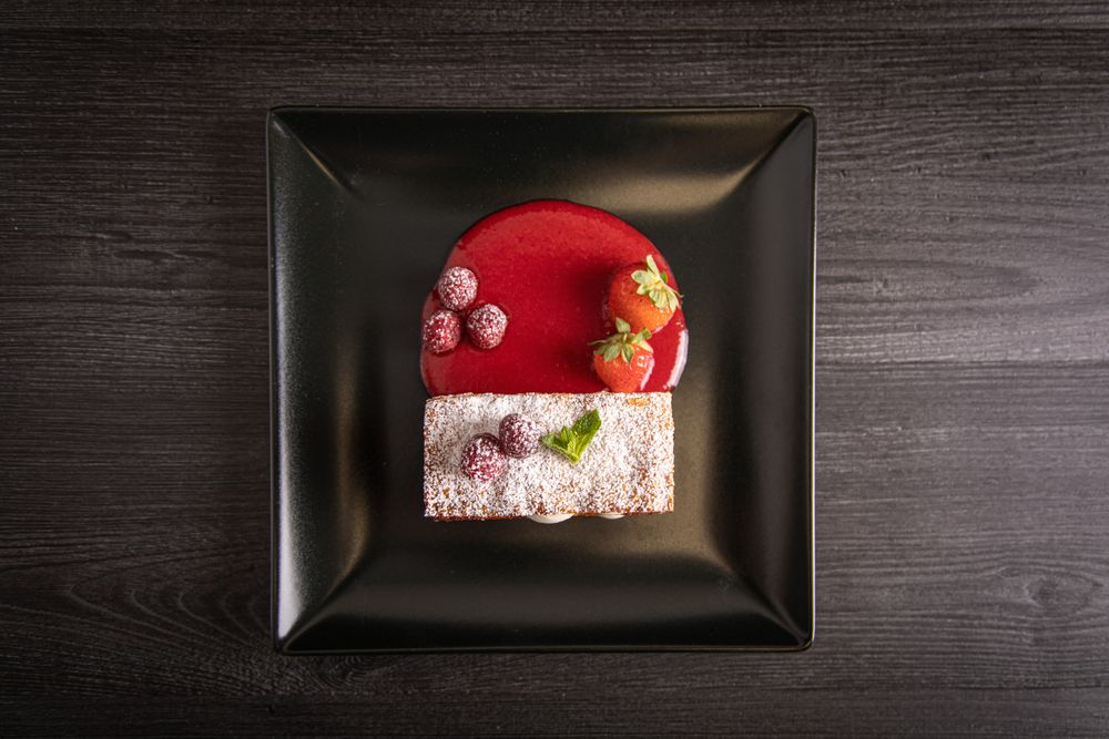 Diphlomate cream and red fruit strudel in elegant plate
