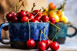 Summer cherries in big blue mug