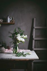 Bunch of fresh white flowers in glass vase