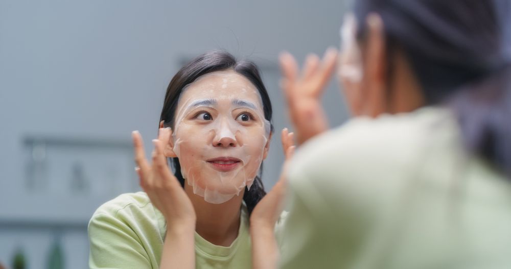 South Korean Female Applying a Facial Hydration Mask as Part of Her Skincare Routine at Home.