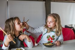 Kids eating vegan food at home