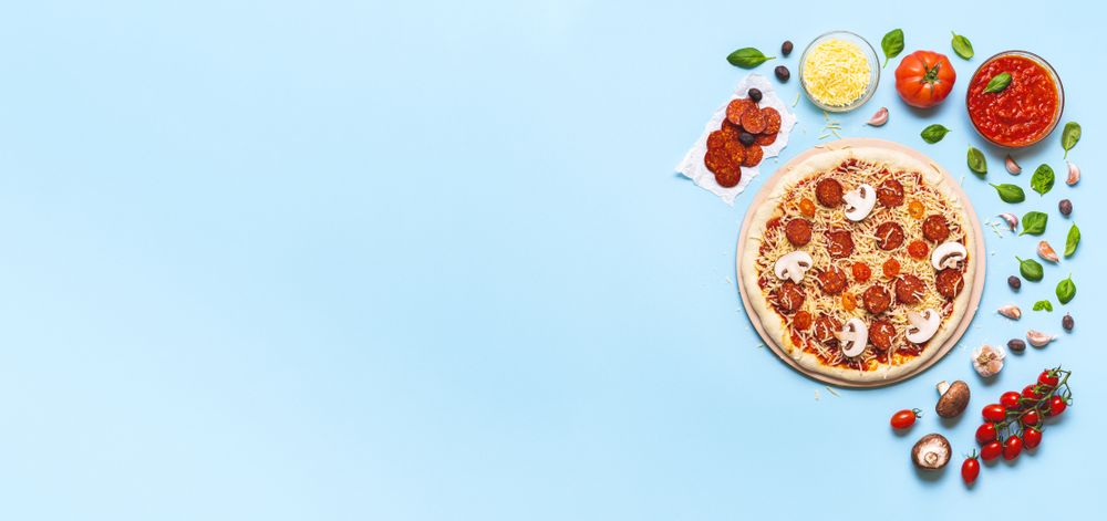 Making pizza pepperoni with mushrooms and cheese