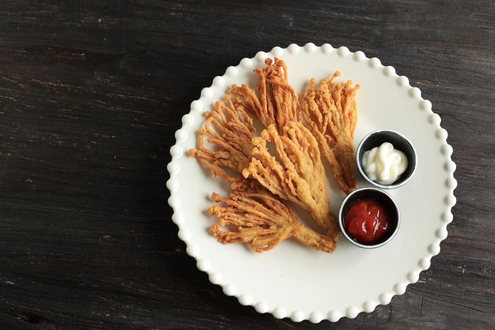 Deep fried enoki mushroom served with condiments