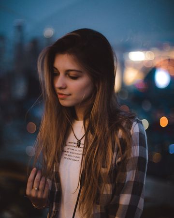 Portrait of young woman outdoor at night